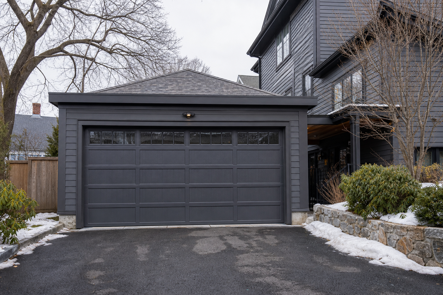 Boston home exterior with a visible garage door on a quiet residential street